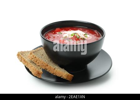 Schüssel Rote Beete Suppe und Brotscheiben isoliert auf weiß Hintergrund Stockfoto