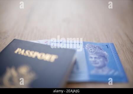 Malaysische Nationalbank auf einem Ringgit Note in einem American Passport Stockfoto