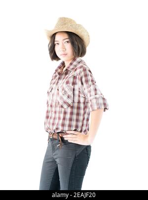 Junge Frau in einem Cowboyhut und karierten Hemd Stockfoto