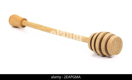 Holz- Honig Pendelarm auf weißem Hintergrund Stockfoto