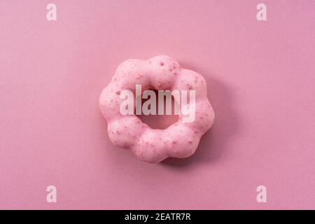 Rosa Donuts auf einem rosa Hintergrund platziert Stockfoto