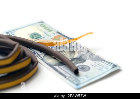 Klebedichtung für Wärmeeinsparungen und 100 US-Dollar, Nahaufnahme, Wärmeeinsparung Stockfoto