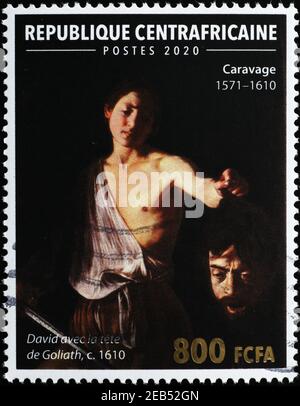 David mit dem Kopf von Goliath von Caravaggio auf Briefmarke Stockfoto