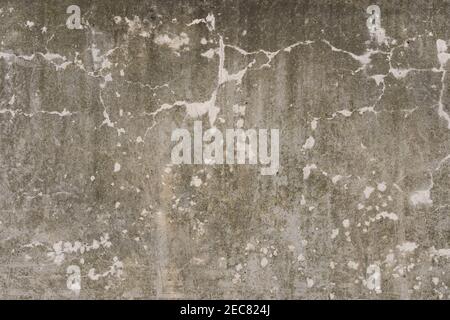 Die Textur des Musters der rauen Grunge Wand mit den Rissen im Gipsmaterial. Gealterte Vintage-Struktur mit feinen Elementen. Stockfoto