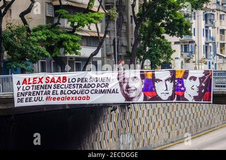 Caracas, Distrito Capital, Venezuela. Februar 2021, 13th. Verschiedene Graffiti in den Hauptstraßen von Caracas, fordern die Veröffentlichung von Alex Saab, mit dem Hashtag #Freealexsaab. Auch Plakate, die darauf hinweisen, dass er als Geisel für die Konfrontation mit der Blockade der Vereinigten Staaten von Amerika gegen Venezuela gehalten wird. Alex Nain Saab MorÃn ist ein kolumbianischer Rechtsanwalt libanesischer Abstammung mit venezolanischer und Antiguanischer Nationalität. Er ist seit dem 12. Juni 2020 auf Kap Verde aufgrund eines Auslieferungsertrages aus den Vereinigten Staaten wegen angeblicher Straftaten inhaftiert. (Bild: © Jimmy Villa Stockfoto