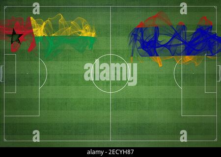 Guinea Bissau vs Armenien Fußballspiel, Nationalfarben, Nationalflaggen, Fußballplatz, Fußballspiel, Wettbewerbskonzept, Kopierraum Stockfoto