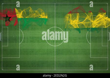 Guinea Bissau vs Bolivien Fußballspiel, Nationalfarben, Nationalflaggen, Fußballfeld, Fußballspiel, Wettbewerbskonzept, Kopierraum Stockfoto