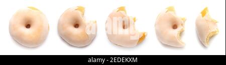 Prozess des Essens lecker Donut auf weißem Hintergrund Stockfoto