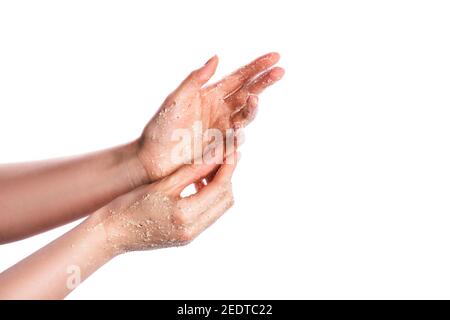 Cremy Peeling für Körper auf weibliche Hand isoliert auf weiß Stockfoto