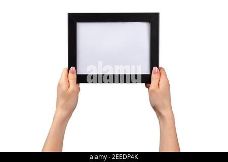 Weibliche Hände halten Fotorahmen isoliert auf weiß Stockfoto
