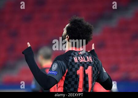 Budapest, Ungarn. Februar 2021, 16th. Fußball: Champions League, K.O.-Runde, 16. Runde, erste Etappe, RB Leipzig - Liverpool FC in der Puskas Arena. Liverpools Mohamed Salah feiert nach dem Tor von 0:1. Kredit: Marton Monus/dpa/Alamy Live Nachrichten Stockfoto