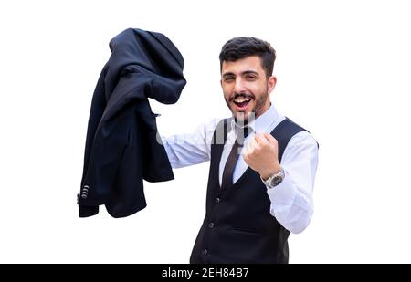 Fröhlicher und aufgeregt Geschäftsmann in einem isolierten Hintergrund feiert seine Erfolge, indem er seine Jacke hält und seine aufhebt Seine Faust zu zeigen Stockfoto
