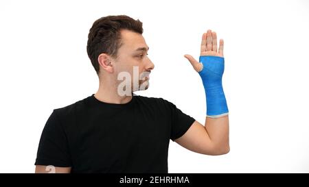 Der Mensch sieht Gips auf weißem Hintergrund Stockfoto
