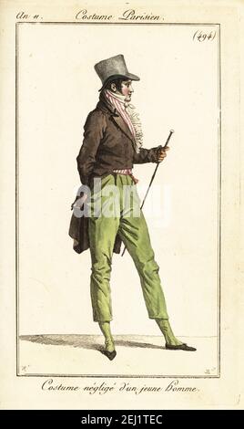 Junger französischer Dandy in lässigem Outfit. Grauer Zylinderhut, gestreifte Weste, Gehrock, Pantalons und Hausschuhe. Kostüm négligé d’un jeune homme. Handkolorierter Kupferstich von Pierre-Charles Baquoy nach Carle Vernet aus Pierre de la Mesangeres Journal des Dames et des Modes, Magazine of Women and Fashion, Paris, an 11, 1803. Stockfoto