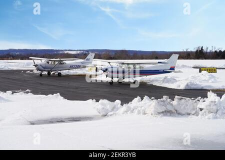 MONTGOMERY, NJ -17 FEB 2021- Winter view of a small airplane at the Princeton Airport (PCT) in Princeton, New Jersey, United States after a snowfall. Stock Photo