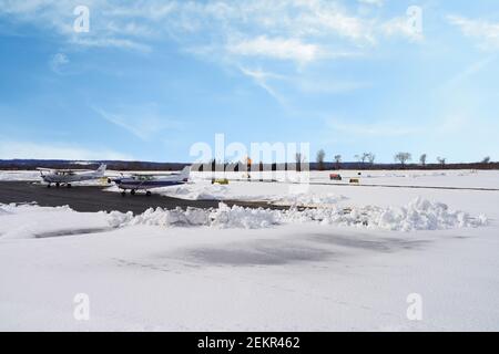 MONTGOMERY, NJ -17 FEB 2021- Winter view of a small airplane at the Princeton Airport (PCT) in Princeton, New Jersey, United States after a snowfall. Stock Photo