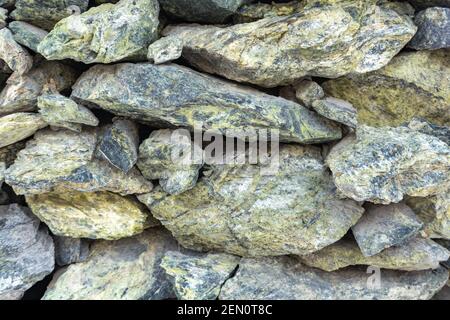 Jadeit Stein Mauerwerk, natürliche Schutt Stein Textur, Jadeit Wand Schutt Stein Hintergrund Stockfoto