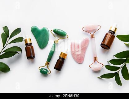 Face massage jade rollers on white background Stockfoto