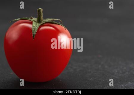 Nahaufnahme der Kirschtomate. Hintergrund für das Essen. Stockfoto