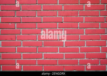 Gemalte rote Backstein Wand Hintergrund. Quadratische Backsteinwand Hintergrund. Muster der roten Backsteinwand Hintergrund Stockfoto