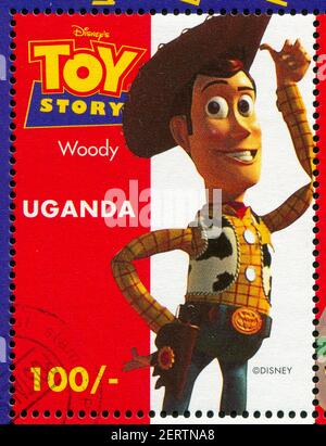 UGANDA - UM 1997: Briefmarke gedruckt von Uganda, zeigt Toy Story, Woody, um 1997. Stockfoto