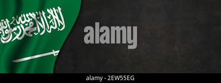 Saudi-Arabien Flagge auf Betonwand. Banner mit Stoffstruktur der Flagge Saudi-Arabiens. Stockfoto