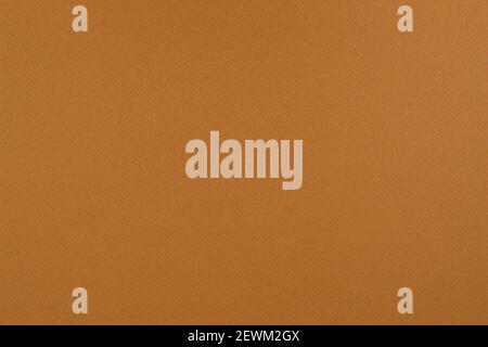 Orangefarbener Papierhintergrund. Papiertextur in Apfelorange. Matte monochrome Oberfläche. Stockfoto