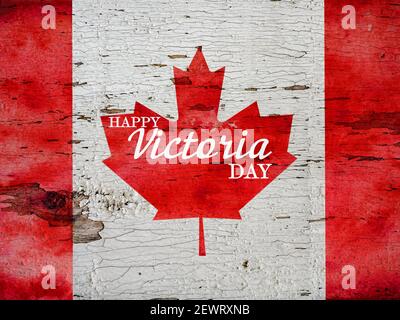 Victoria Day Schriftzug auf dem Hintergrund der kanadischen Flagge. Wunderschöne Karte. Nahaufnahme, Blick von oben. Nationales Urlaubskonzept. Herzlichen Glückwunsch für Stockfoto