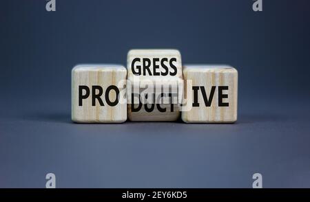 Produktives und progressives Symbol. Drehte Würfel und änderte das Wort "progressiv" zu "produktiv". Schöner grauer Hintergrund, Kopierbereich. Business, p Stockfoto