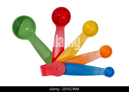 Ein farbenfrohes Set aus Messlöffeln aus Kunststoff in Größen ab 1 Esslöffel bis 1/4 Teelöffel Stockfoto