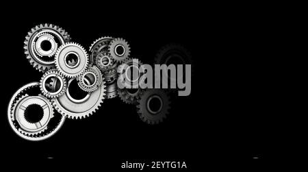 Industriegetriebe und Zahnräder auf schwarzem Hintergrund. Speicherplatz kopieren. Stockfoto