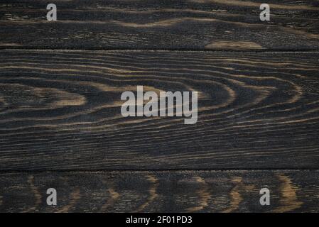 Holzstruktur Hintergrund, Draufsicht auf dunklen rauen Holztisch. Rustikale braune Holzplanken für Hintergrund und Tapete. Lackierte Oberfläche von alten Stallbrettern Stockfoto