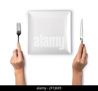 Frau Hände halten eine silberne Gabel und Messer Stockfoto