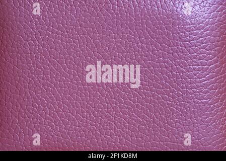Textur der magentafarbenen Rindslederoberfläche für abstrakten Hintergrund Stockfoto