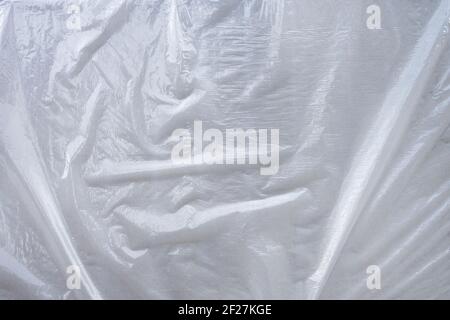 Muster strukturiert weiß grau Plastikfolie über einer Ebene Oberfläche mit Falten Stockfoto