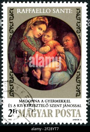 UNGARN - UM 1983: Eine in Ungarn gedruckte Briefmarke, zeigt das Gemälde der Madonna della seggiola, von Raffaello Santi, um 1983 Stockfoto