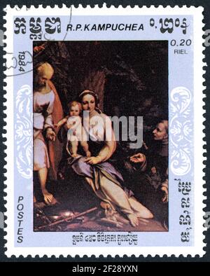 KAMPUCHEA - UM 1984: Eine in Kampuchea gedruckte Briefmarke, zeigt die Details von Gemälden: Rest on Flight into Egypt, von Antonio da Correggio, um 1984 Stockfoto