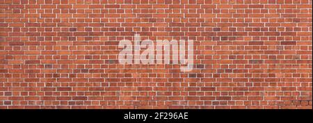 Alte, schmutzige, rote Backsteinmauer - Panorama Detail Stockfoto