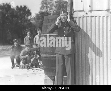 George Formby. Britische Sängerin, Schauspieler als Ukulele-Mann bekannt. 1904-1961. Er war der am höchsten bezahlte britische Schauspieler 1940. Im Bild während einer Rolle in einem Film Stockfoto