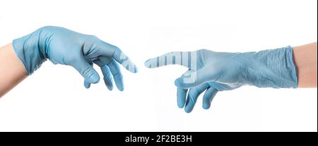Hände mit blauem Handschuh nach Michelangelos Gemälde von Gott erschafft den Menschen die Schöpfung Adams Stockfoto