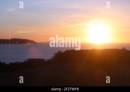 Sonnenaufgang über dem atlantik, vom Fenster aus gesehen Des Carlyon Bay Hotel Restaurant zum Frühstück über Weihnachten Stockfoto