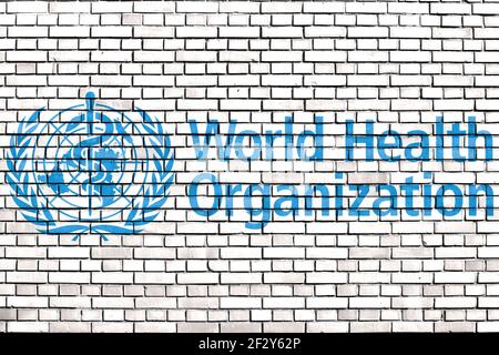 Flagge der Weltgesundheitsorganisation gemalt auf Ziegelwand Stockfoto