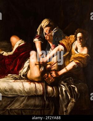 Judith Beheading Holofernes - Artemisia Gentileschi, um 1620 - zwei Frauen stecken einen Mann auf ein Bett. Mit einer Hand hält Judith seinen Kopf, mit der anderen schneidet sie sich mit einem langen Schwert in die Kehle. Die Intensität der Szene wird durch das tropfende Blut hervorgehoben, das die weißen Bettlaken durchtränkt und die Augen des Mannes weit geöffnet sind – bewusst, aber hilflos. Artemisia ist mehr eine Verfechterin starker Frauen als eine Frau, die von Gewalt und Rache besessen ist. Stockfoto