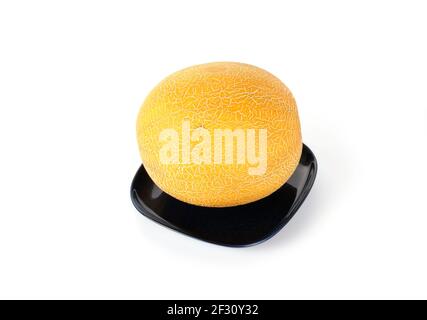 Stillleben mit einer natürlichen reifen Melone auf einem sauberen Weißer Hintergrund Stockfoto