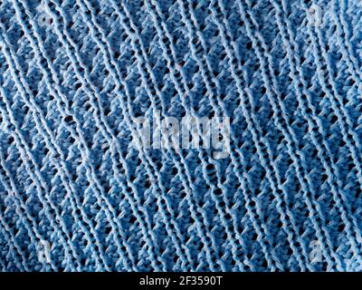 Struktur aus gestricktem blauen Pullover, Pullover, warme Kleidung Konzept Stockfoto