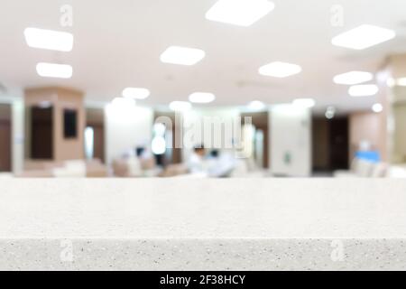 Steinplatte auf verwackelte Krankenhaus Lobby Hintergrund - kann sein Wird zur Anzeige oder Montage Ihrer Produkte verwendet Stockfoto