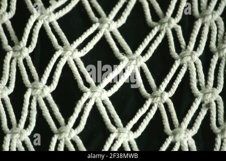 Diese Kunst Macrame Handwerk aus gehäkeltem Seil für die Inneneinrichtung zu Hause Dekoration. Stockfoto