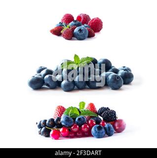 Beeren isoliert auf weißem Hintergrund. Reife Heidelbeeren, wilde Erdbeeren, rote und schwarze Johannisbeeren, Erdbeeren, Maulbeeren und Stachelbeeren. Zurück Stockfoto