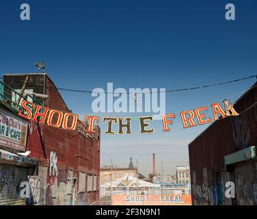 Coney Island is famous for its amusements, boardwalk, seaside cafes and fairground attractions and is popular with both tourists and residents of New Stock Photo