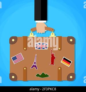 Aktentasche mit Aufklebern in der Hand. Stock Vektor